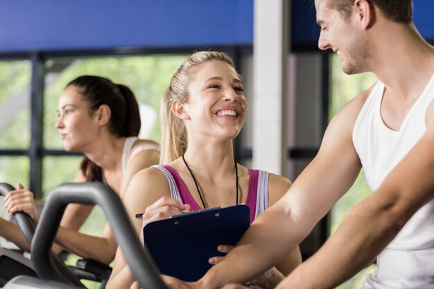 Gym trainer coaching a client